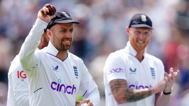 England's Jack Leach (left) celebrates with a 5 wicket ball during day two of the third LV= Insurance Test Series Match at Emerald Headingley Stadium, Leeds. Picture date: Friday June 24, 2022. PA Photo. See PA story CRICKET England. Photo credit should read: Mike Egerton/PA Wire. RESTRICTIONS: Editorial use only. No commercial use without prior written consent of the ECB. Still image use only. No moving images to emulate broadcast. No removing or obscuring of sponsor logos.