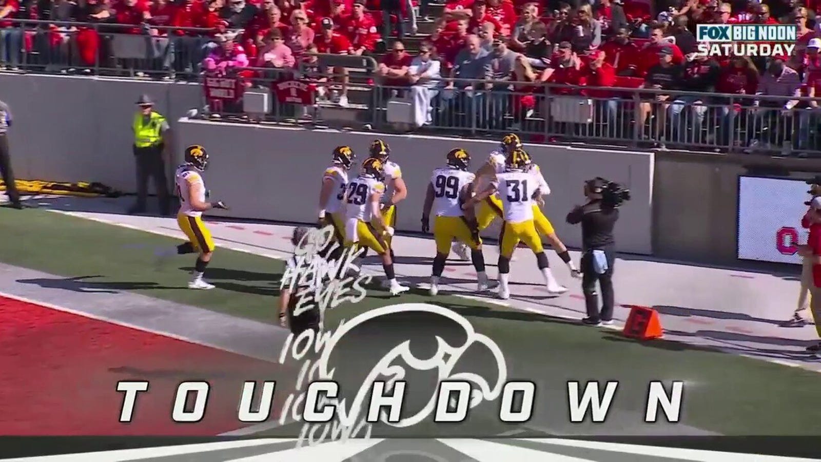 Iowa's Joe Evans recovers a fumble and runs it back for an 11-yard touchdown
