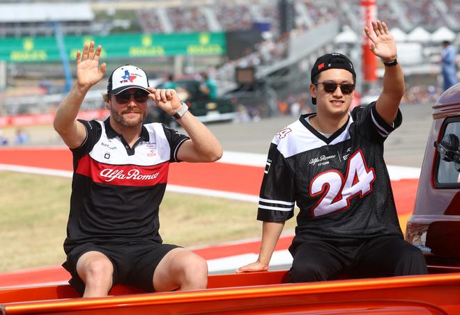 Alfa Romeo’s Valtteri Bottas (left) and Guanyu Zhou (right) wave to the spectators during the drivers’ parade ahead of the US Grand Prix on October 23, 2022.