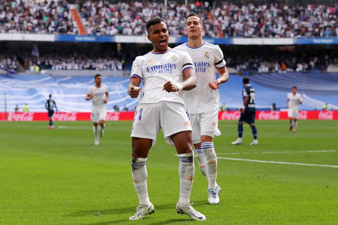 Rodrygo of Real Madrid celebrates with teammate Lucas Vazquez after scoring their team’s second goal during the LaLiga match against Espanyol. 